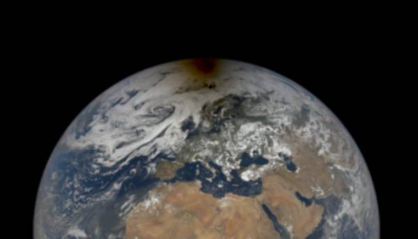 On Earth NASA’s profound space satellite catches the dull shadow of an eclipse