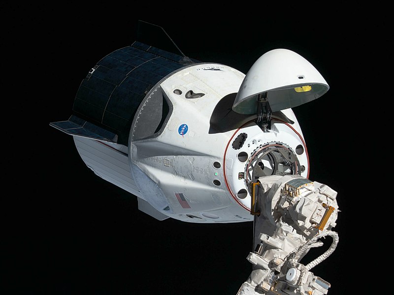 From space station for trip back to Earth, SpaceX Dragon freight transport undocks